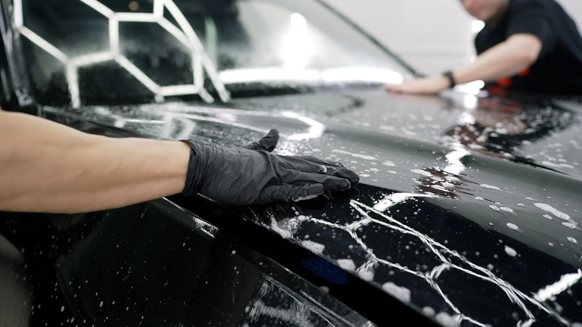 exterior detailing Hand washing a car exterior during detailing