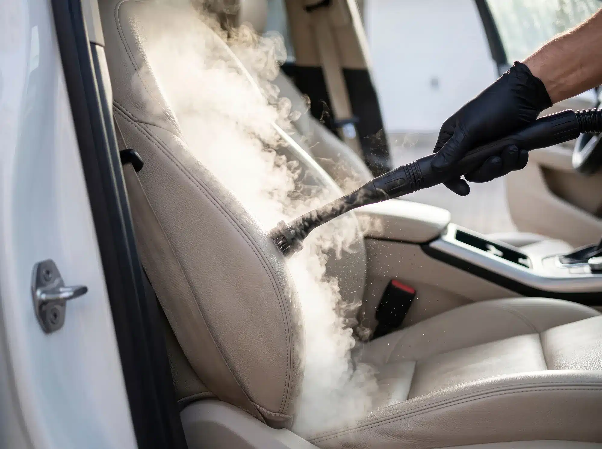 interior deep cleaning upholstry Detailer vacuuming vehicle carpets