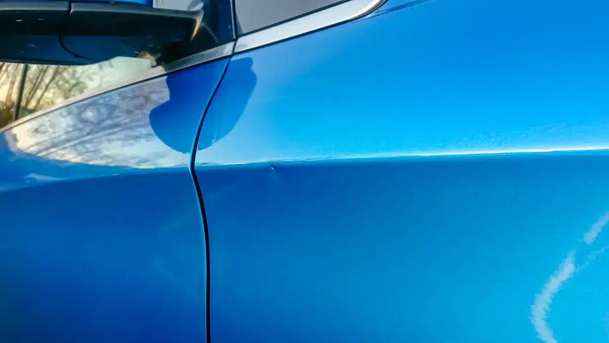 Small shallow dent on a car panel