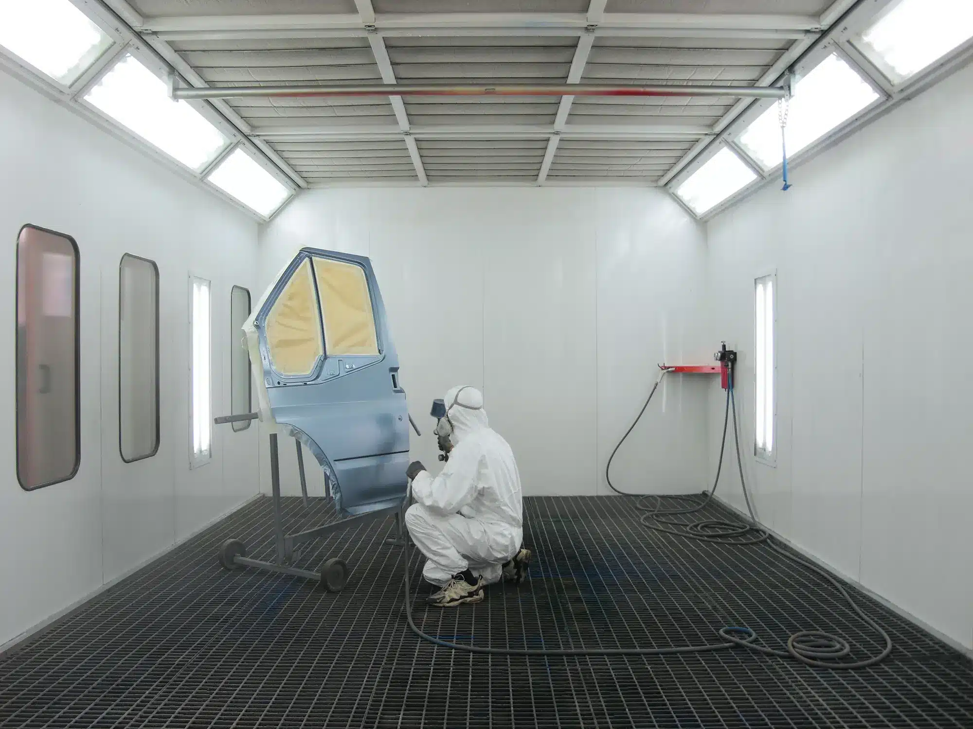 Painter refinishing a single body panel